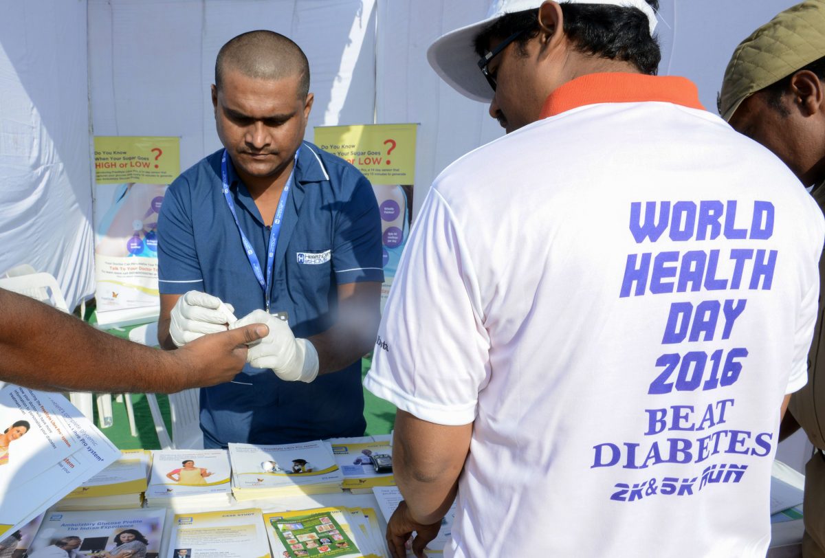 An Indian nurse (C) collects a blood sample using a glucometer at a free diabetic health check up camp on World Health Day in Hyderabad on April 7, 2016.
The number of adults estimated to be living with diabetes has nearly quadrupled over 35 years, the World Health Organization (WHO) said on April 6, urging huge efforts to change eating habits and exercise more. "Beat Diabetes" is the theme of World Health Day 2016, a global health awareness day celebrated every year on April 7.(Noah Seelam/AFP/Getty Images)