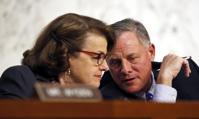 In this Feb. 9, 2016 file photo, Senate Intelligence Committee Vice Chair Sen. Dianne Feinstein, D-Calif., talks with committee chairman Sen. Richard Burr, R-N.C. on Capitol Hill in Washington. A draft version of a Senate bill would effectively prohibit unbreakable encryption and require companies to help the government get access to readable data on a device if theres a lawful search warrant. The draft is being finalized by Burr and Feinstein. (AP Photo/Alex Brandon, File)