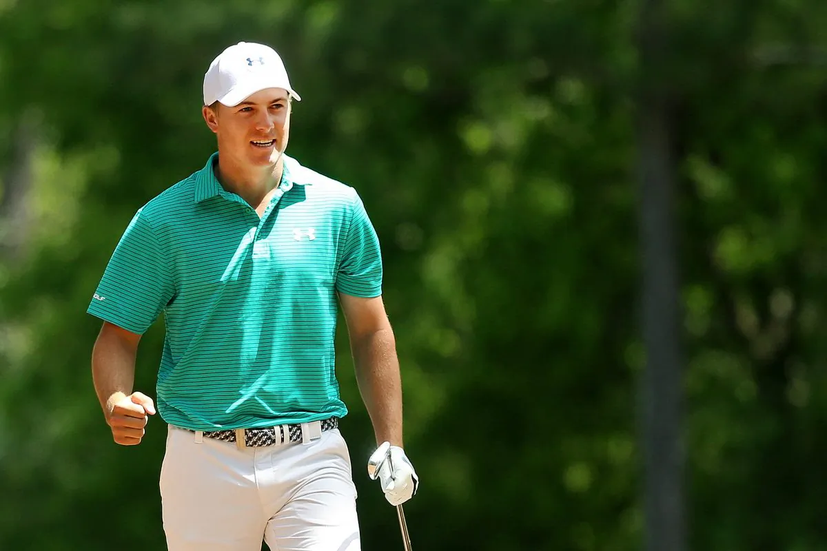 Jordan Spieth reacts after playing his second shot on the 11th hole during the first round of the 2016 Masters Tournament at Augusta National Golf Club on April 7. (Andrew Redington/Getty Images) 