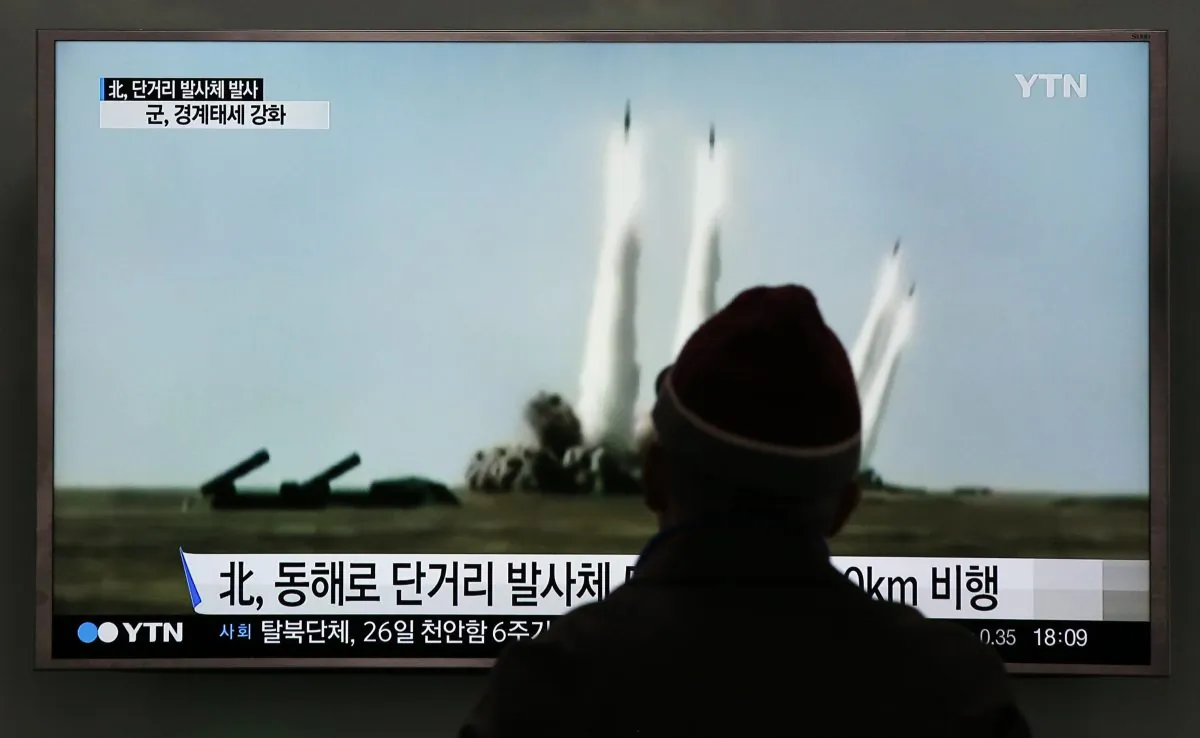 A man watches a TV screen showing a file footage of the missile launch conducted by North Korea, at Seoul Railway Station in Seoul, South Korea, Monday, March 21, 2016. (AP Photo/Lee Jin-man)