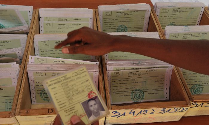 A Djiboutian electoral agent searching for a voters card at a polling station in Djibouti on March 22, 2016. Elections in Djibouti are scheduled to be held in April 2016. Current President Ismail Omar Guelleh, who has been in office since May 8, 1999, is up for re-election. (Simon Maina/AFP/Getty Images)