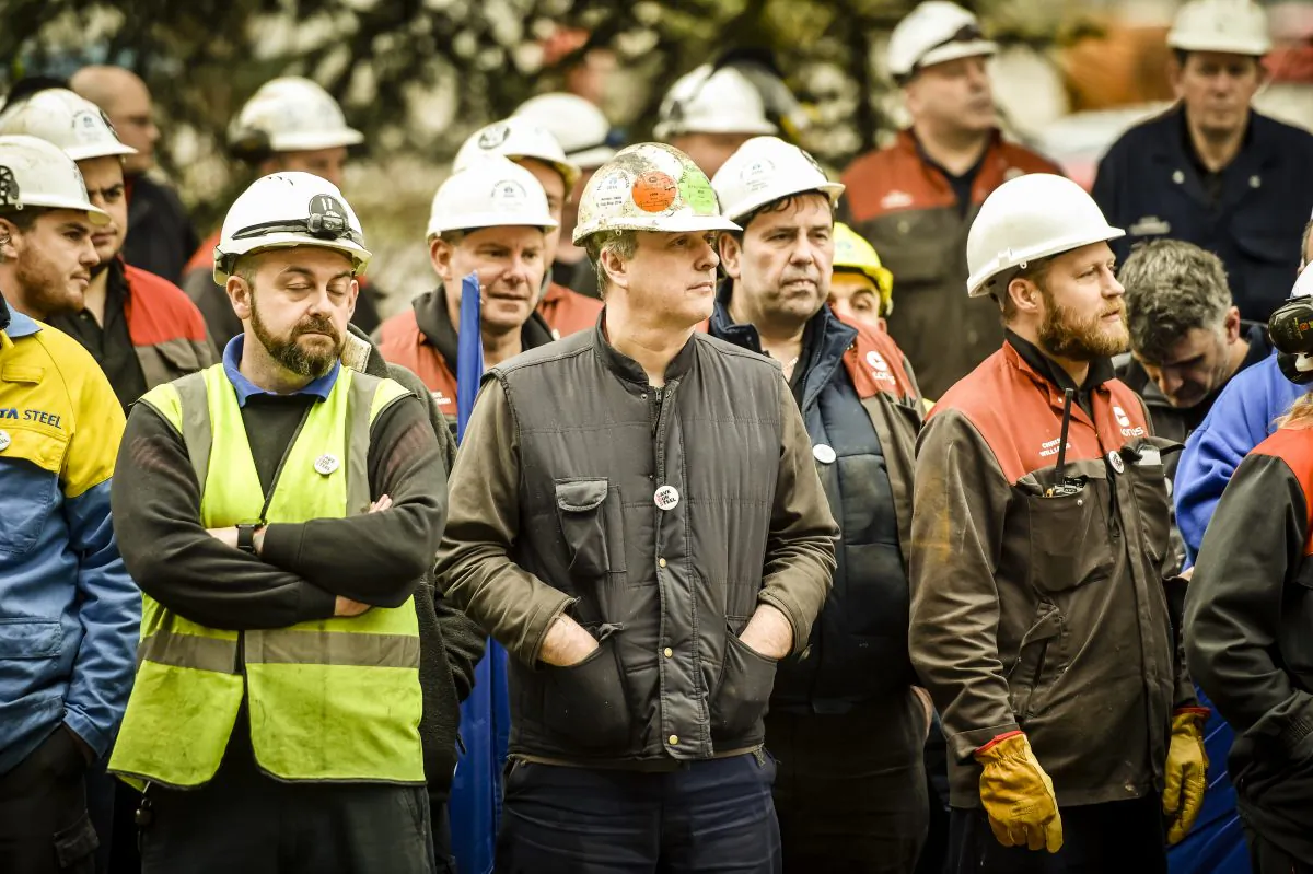 Workers gather at Tata Steel as business secretary Sajid Javid leaves Tata steel works in Port Talbot, Wales, on April 1, 2016. Owners Tata Steel have put its British business up for sale placing thousands of U.K. jobs at risk. The business secretary visited the steel works to discuss with senior management how the U.K. government can support the site and maintain steel making in Port Talbot. (Ben Birchall/Getty Images)