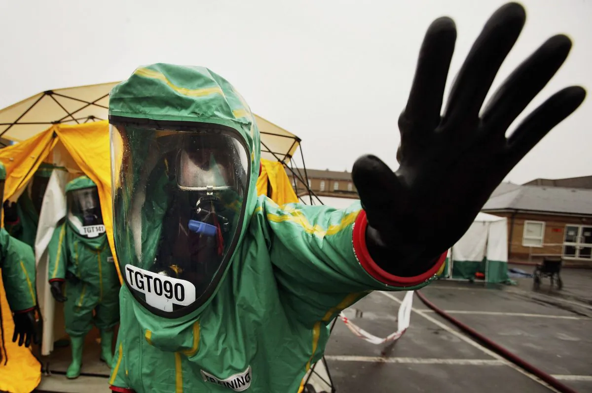 Emergency services exercise their abilitys in tackling a major contamination incident at Mayday hospital in Croydon, England, on April 23, 2006. The exercise involved decontamination units with representatives from ACHES (Association of Casualty and Health Emergency Simulators) playing the parts of the casualties. (Bruno Vincent/Getty Images)