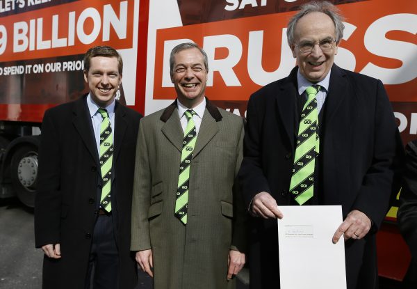 Conservative Members of Parliament, Tom Pursglove (L) and Peter Bone (R), stand with Nigel Farage, leader of Britain's UKIP party, as they hold the application letter outside the Electoral Commission in London on March 31, 2016. With less than three months to go until a June 23 referendum, Britain's anti-EU campaigners are bitterly divided, with two rival camps battling over which will be the standard-bearer in the campaign, and over how to win the historic vote. (AP Photo/Kirsty Wigglesworth)