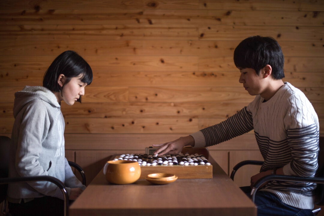 "Go" teacher Jo Gyung-Ho (R) plays against Japanese student Mori Chisaki at the Lee Se-Dol School for "Go" in Seoul, Korea, on March 18.  (Ed Jones/AFP/Getty Images)