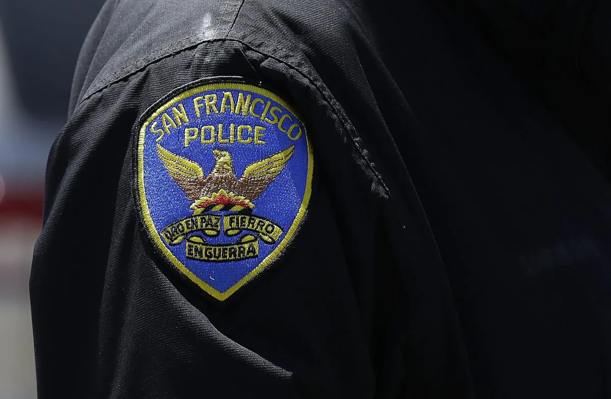 In this May 12, 2015 photo, a San Francisco Police officer stands on a street in San Francisco. (Jeff Chiu/AP Photo)