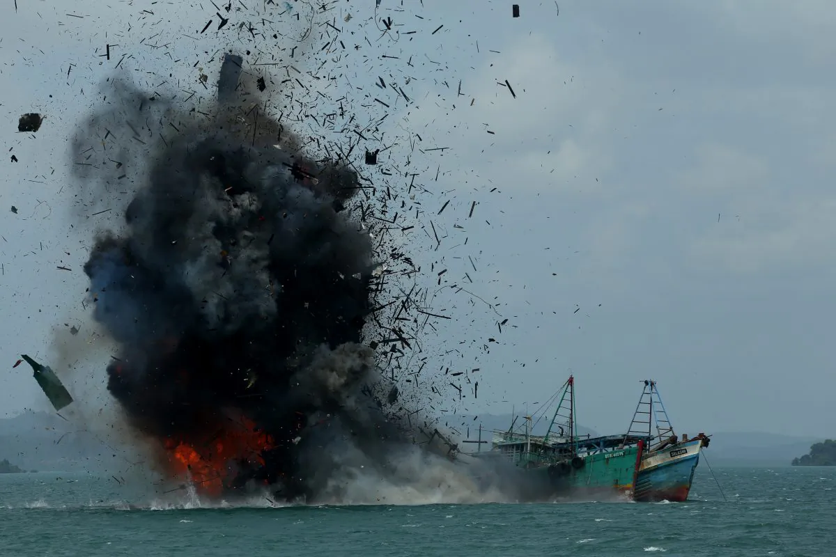 One of seven fishing boats is blown up by the Indonesian government in Batam, Kepulauan Riau province on Feb. 22, 2016. Indonesia destroyed 23 fishing boats after a recent maritime dispute with Chinese authorities. (Sei Ratifa/AFP/Getty Images)