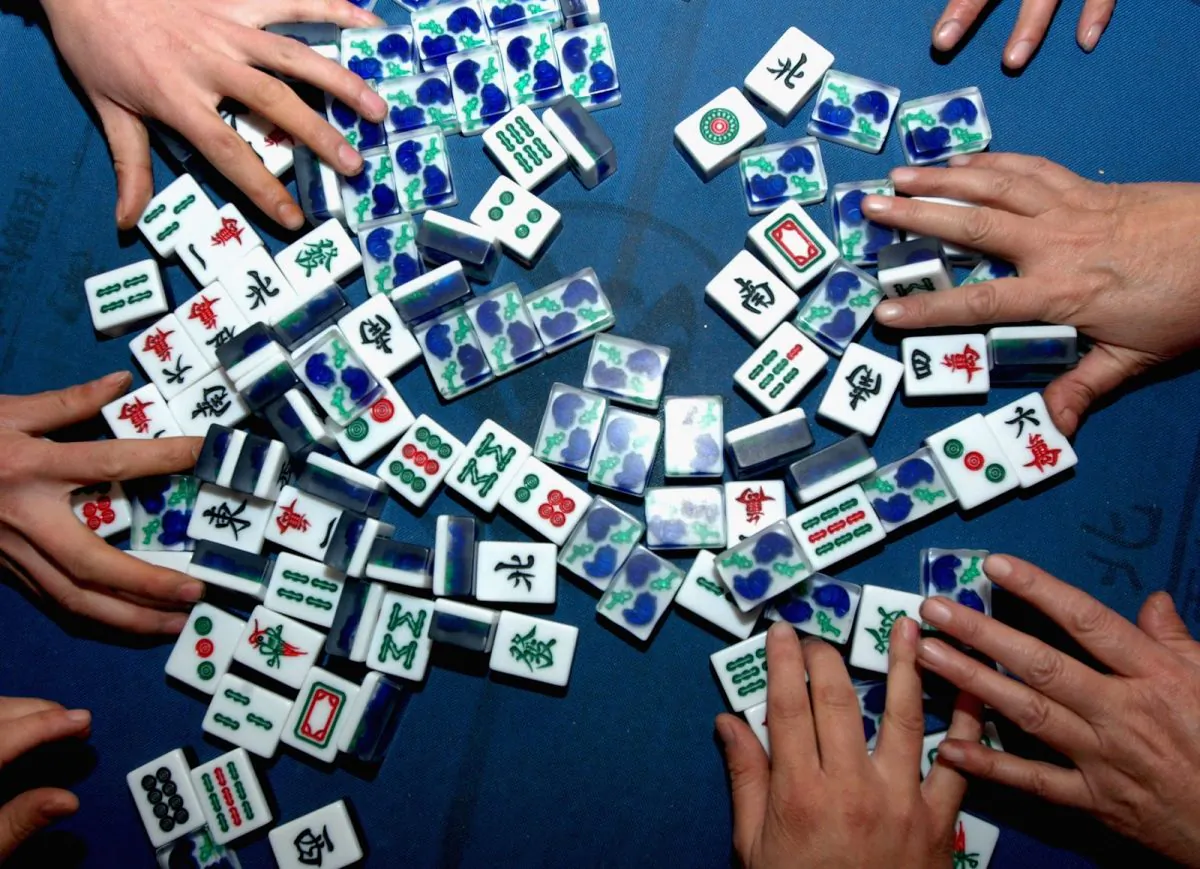 People play mah-jong on Chinese New Year Day in Fu County of Shaanxi Province, China, in a file photo. (China Photos/Getty Images)