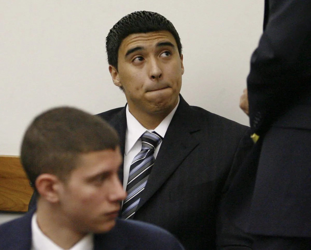 Esteban Nunez, center, son of former California Assembly Speaker Fabian Nunez, and Rafael Garcia, left, look on during a preliminary hearing on murder charges in Superior Court  Wednesday, March 18, 2009 in San Diego.  (AP Photo/Denis Poroy)