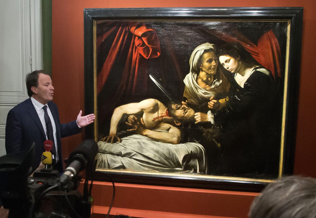 Auction officer Marc Labarbe presents the painting to the media in Paris, Tuesday, April 12, 2016. (AP Photo/Michel Euler)