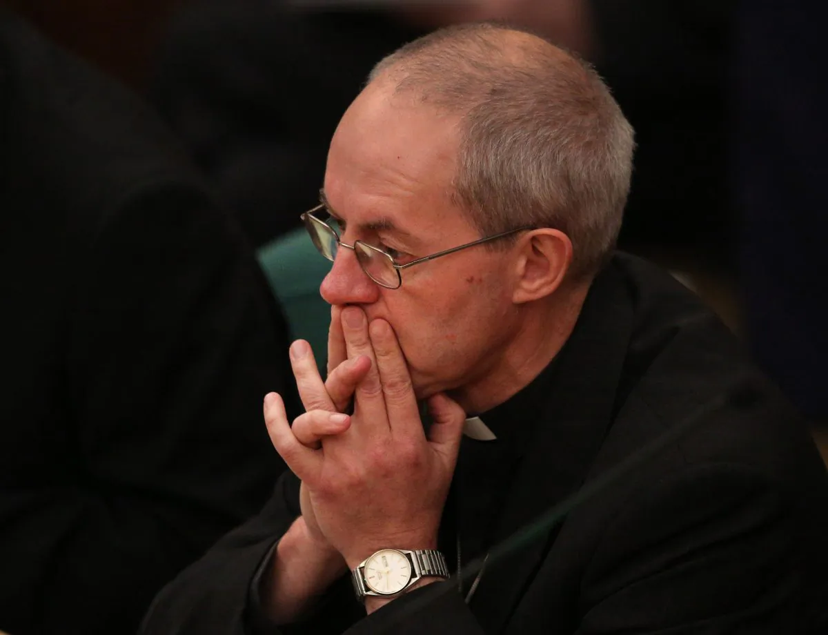 Justin Welby, the Archbishop of Canterbury, waits to hear the results of a vote on the ordination of women bishops during the General Synod at Church House in London, England, on Nov. 20, 2013. The Church of England's governing body has voted for a proposal which may allow the ordination of woman as bishops in 2014. (Peter Macdiarmid/Getty Images)