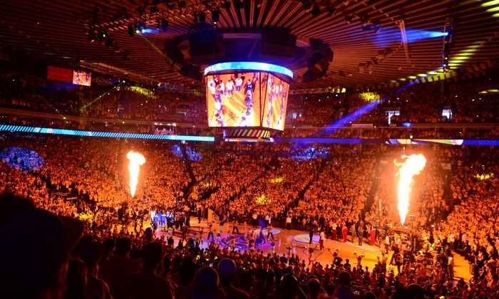 Players from the Golden State Warriors and Cleveland Cavaliers are introduced prior to the start of Game 5 of the 2015 NBA Finals at the Oracle Arena in Oakland, Calif., on June 14, 2015. (Frederic J. Brown/AFP/Getty Images)