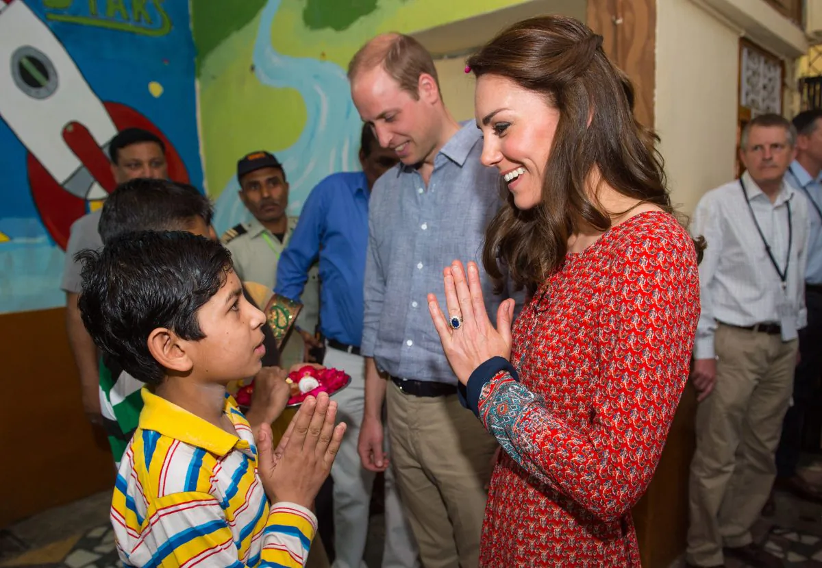 NEW DELHI, INDIA - APRIL 12:  Catherine, Duchess of Cambridge and Prince William, Duke of Cambridge visit a contact centre run by the charity Salaam Baalak, which provides emergency help and long term support to homeless children at New Delhi railway station on April 12, 2016 in New Dehli, India. The Duke and Duchess of Cambridge are on a week-long tour of India and Bhutan taking in Mumbai, Delhi, Assam, Bhutan and Agra. (Photo by Dominic Lipinski - Pool/Getty Images)