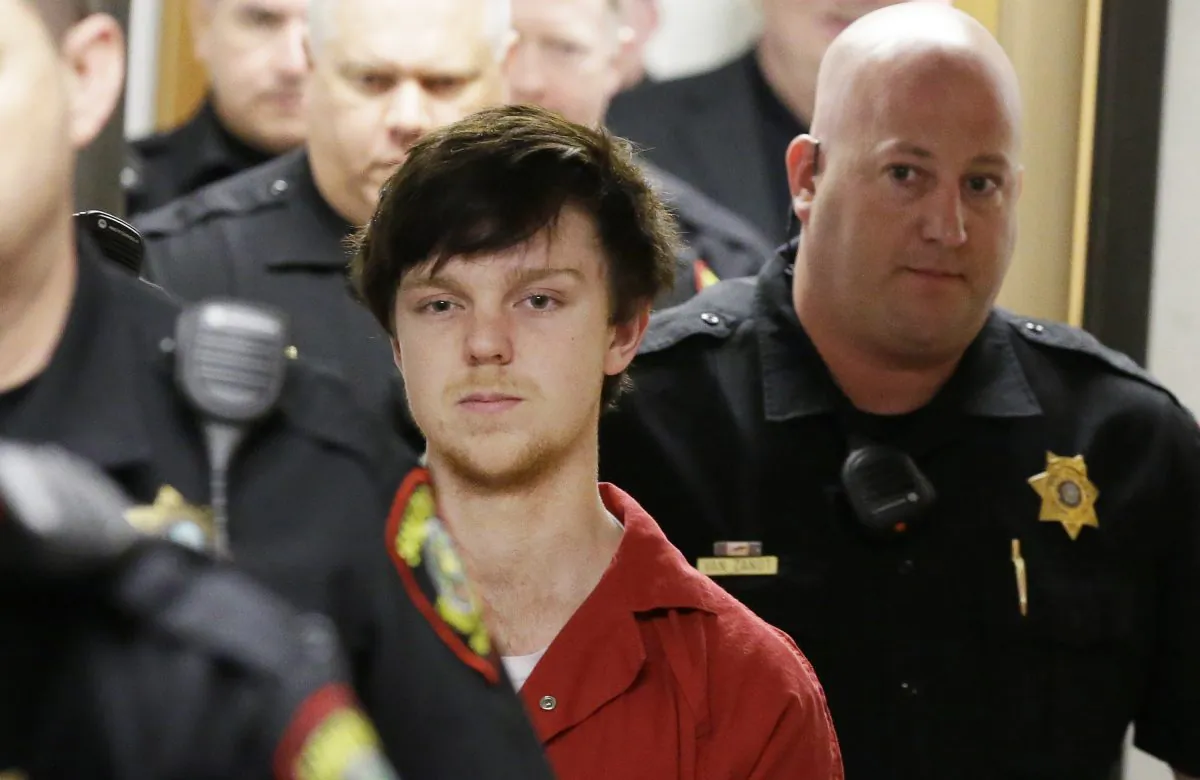 In this Feb. 19, 2016 photo, Ethan Couch is led by sheriff deputies after a juvenile court for a hearing in Fort Worth,  (AP Photo/LM Otero, File)