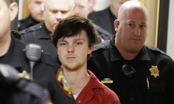 In this Feb. 19, 2016 photo, Ethan Couch is led by sheriff deputies after a juvenile court for a hearing in Fort Worth,  (AP Photo/LM Otero, File)