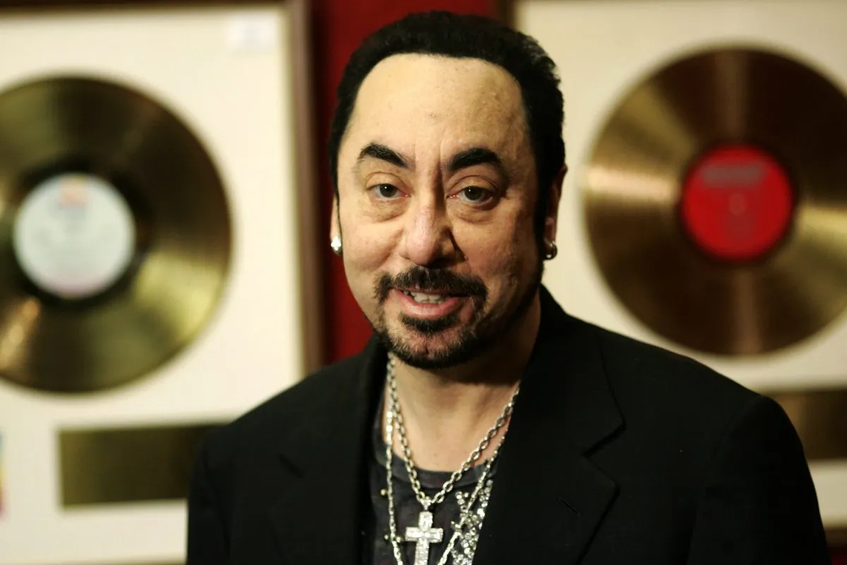 In this Wednesday, Nov. 21, 2007 file photo, U.S. music producer David Gest poses with some of his collection of entertainment memorabilia at an auction house in London. Music producer David Gest, ex-husband of Liza Minnelli, died Tuesday, April 12, 2016 at 62. (AP Photo/Sang Tan, file)