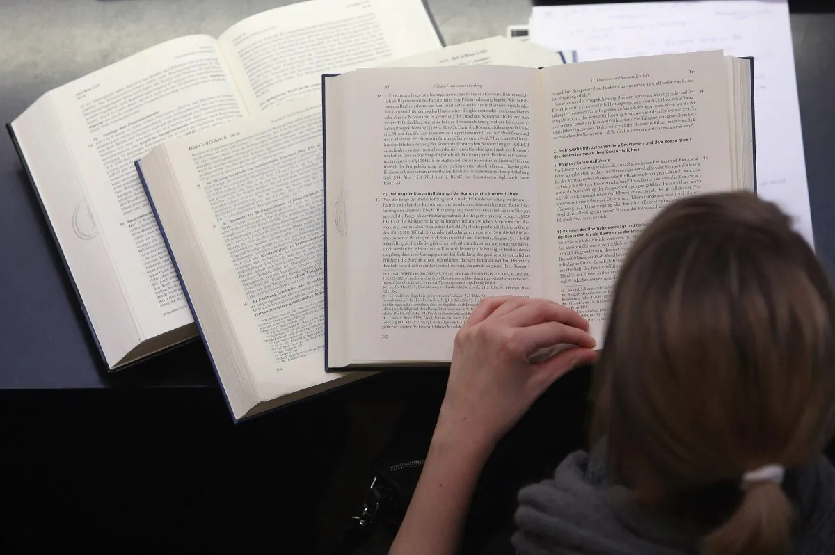 A student studies legal textbooks in the law faculty at Humboldt University in Berlin, Germany, on Oct. 11, 2011. (Adam Berry/Getty Images)
