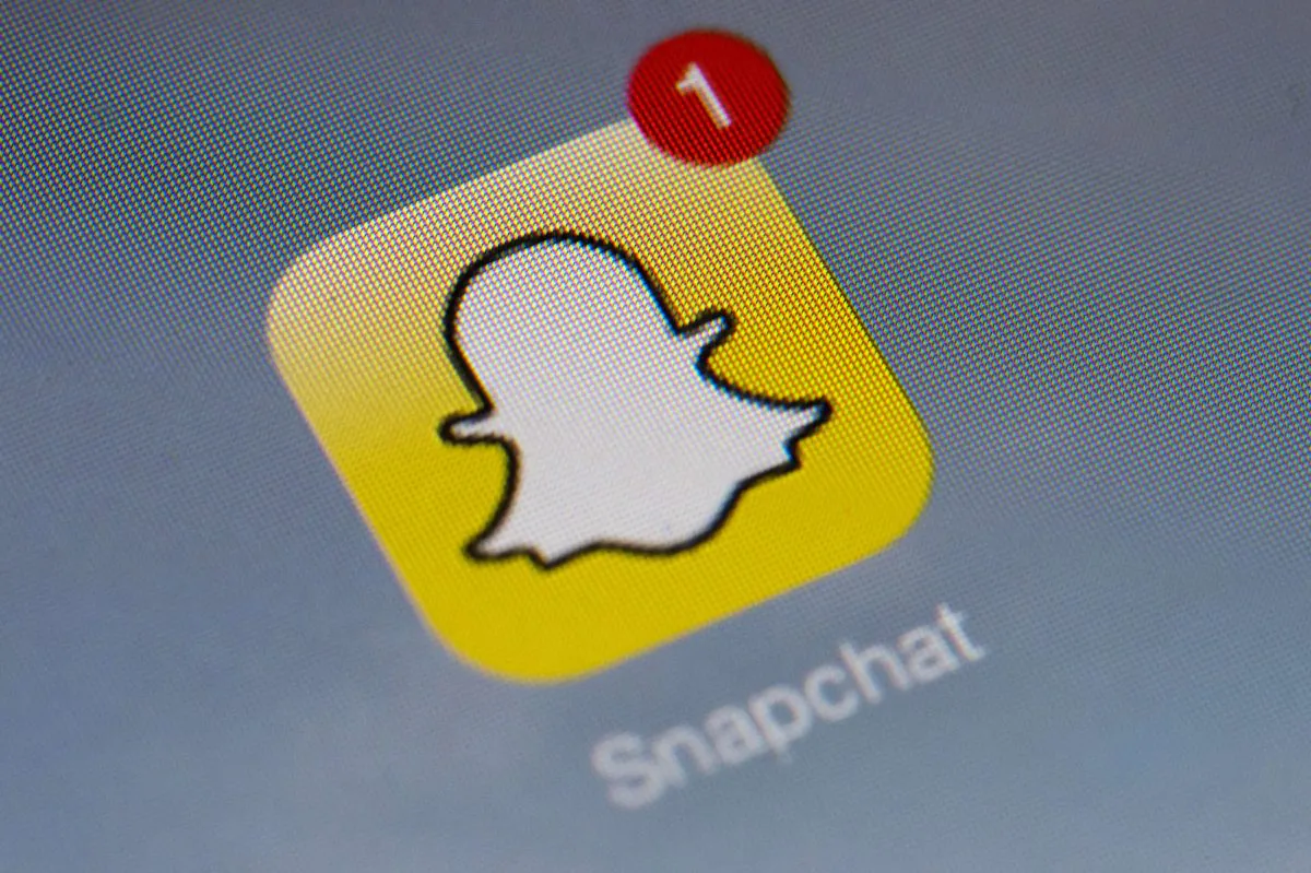 The logo of mobile app Snapchat is displayed on a tablet on January 2, 2014 in Paris. The video messaging giant is considering an initial public offering in early  2017. (Lionel Bonaventure/AFP/Getty Images)