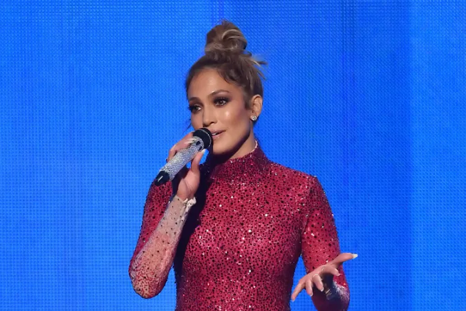 Host Jennifer Lopez performs speaks onstage during the 2015 American Music Awards at Microsoft Theater on November 22, 2015 in Los Angeles, California. (Photo by Kevin Winter/Getty Images)