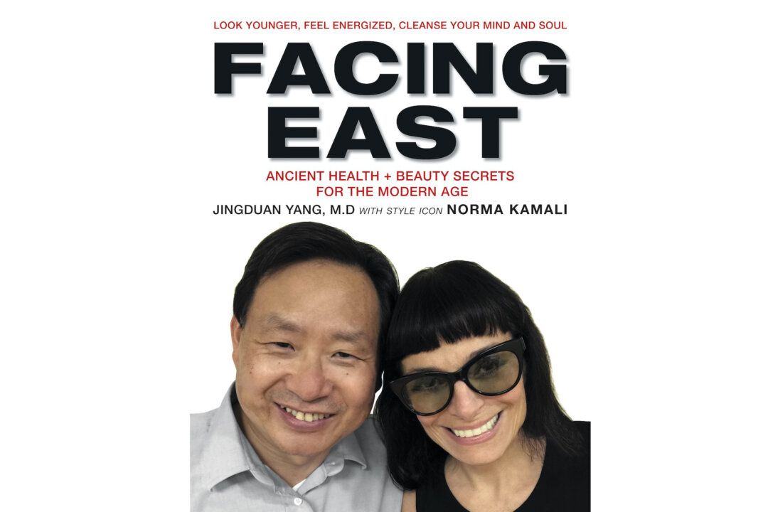 The book cover of "Facing East" by Jingduan Yang, M.D., F.AP.A. with style icon Norma Kamali. (Courtesy of Harper Collins Publishers)