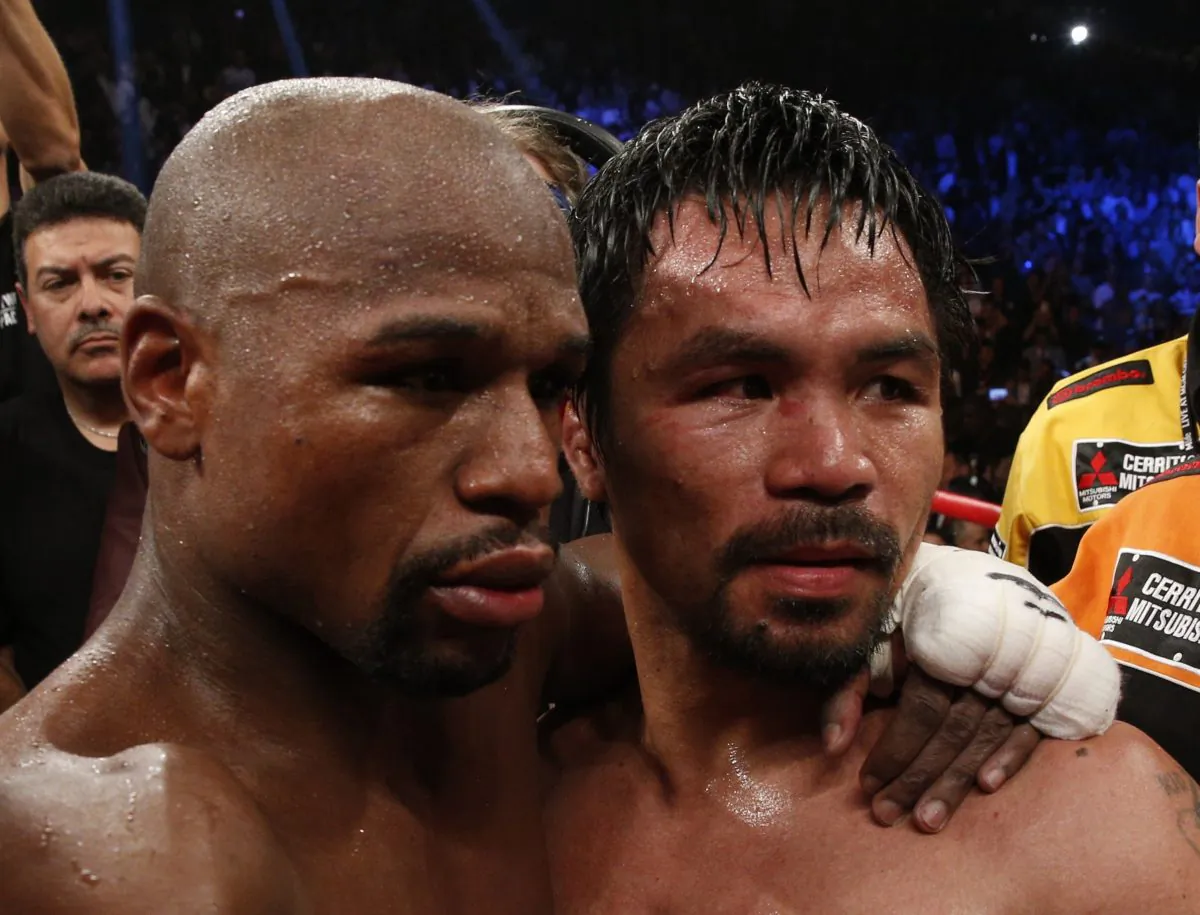 Floyd Mayweather Jr., (L) beat Manny Pacquiao in one of the most anticipated boxing bouts ever. Could there be a rematch? (John Gurzinski/AFP/Getty Images)