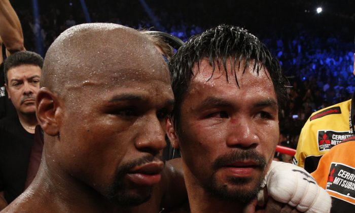 Floyd Mayweather Jr., (L) beat Manny Pacquiao in one of the most anticipated boxing bouts ever. Could there be a rematch? (John Gurzinski/AFP/Getty Images)
