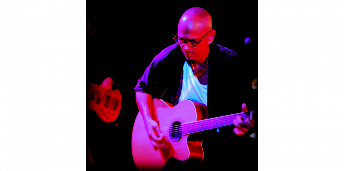 Songwriter, guitarist, and producer Timothy Trieste performs onstage with The Pearls of Life. (Courtesy of Sound of the Muse Records)
