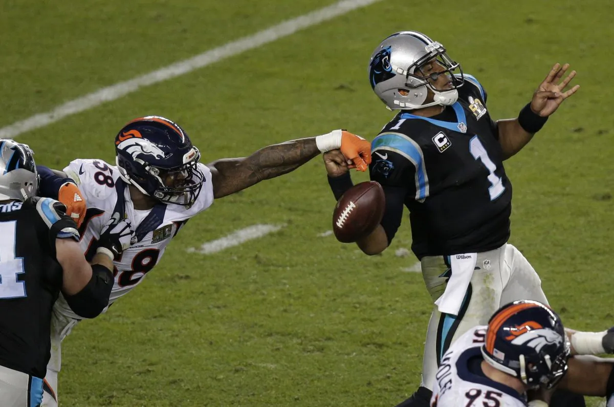 Von Miller (L) stripped the ball from Cam Newton twice in Super Bowl 50 for a pair of crucial forced fumbles that led directly to a pair of Denver TDs in the Broncos' 24–10 win over the Panthers. (AP Photo/Charlie Riedel)