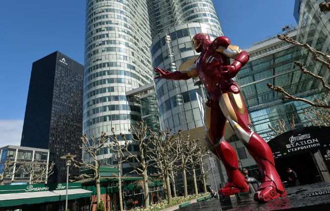 A photo taken on April 13, 2016 shows a statue of 'Iron Man', a Marvel Comics superhero, outside the interactive Marvel Avengers STATION exhibition in the bussines district of La Defense, west of Paris. (AFP/ MIGUEL MEDINA)