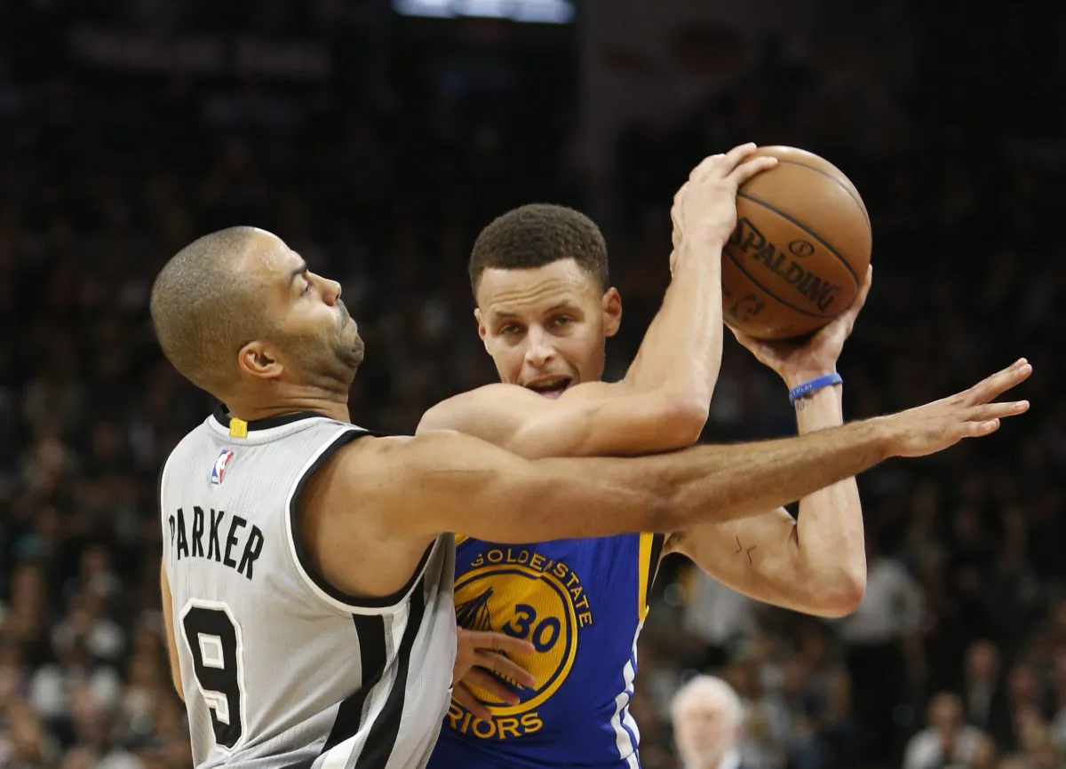 Stephen Curry (R) and the Golden State Warriors would likely have to get past Tony Parker and the San Antonio Spurs in order to repeat as champions. (Ronald Cortes/Getty Images)