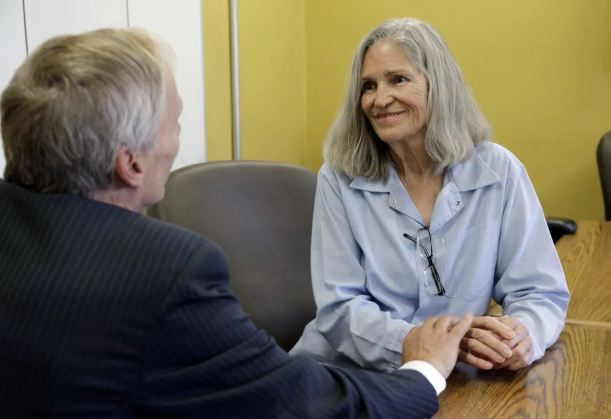 Former Charles Manson follower Leslie Van Houten confers with her attorney Rich Pfeiffer during a break from her hearing before the California Board of Parole Hearings at the California Institution for Women in Chino, Calif., Thursday, April 14, 2016. (AP Photo/Nick Ut)