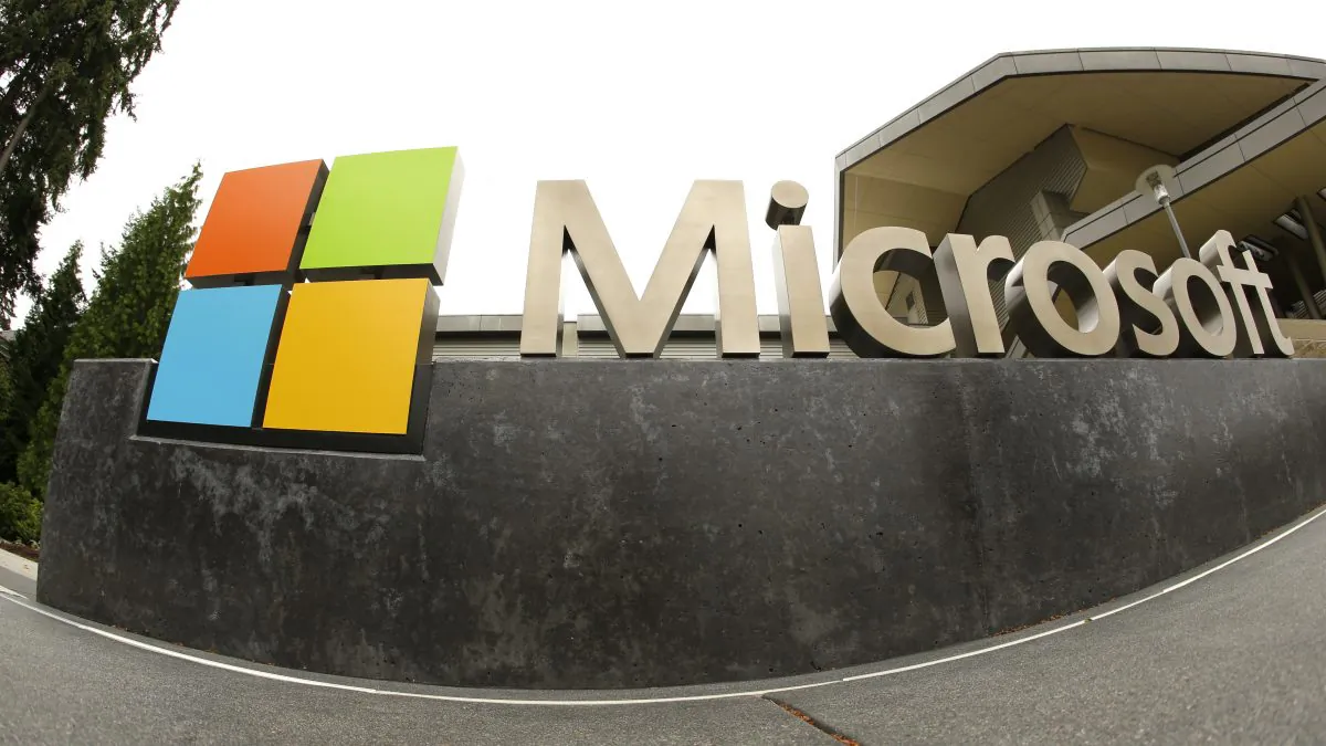 FILE - This July 3, 2014, file photo, shows the Microsoft Corp. logo outside the Microsoft Visitor Center in Redmond, Wash. In a lawsuit filed Thursday, April 14, 2016, Microsoft is suing the U.S. government over a federal law that lets authorities examine its customers’ email or online files without the customers’ knowledge. The lawsuit comes as the tech industry is increasingly butting heads with U.S. officials over customers’ privacy rights. (AP Photo Ted S. Warren, File)