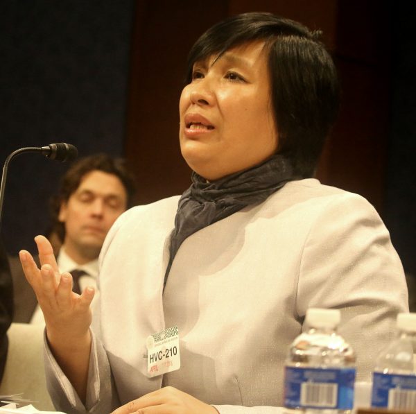 Yin Liping testifies before the Congressional-Executive Commission on China, April 14, on "China's Pervasive Use of Torture." Ms. Liping is a Falun Gong practitioner who survived torture, forced labor, and sexual violence in Masanjia and other forced labor camps in communist China. (Gary Feuerberg/Epoch Times)
