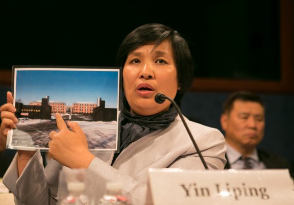 Yin Liping testifies before the Congressional-Executive Commission on China, April 14, on "China's Pervasive Use of Torture." Ms. Yin is a Falun Gong practitioner who survived torture, forced labor, and sexual violence in Masanjia and other forced labor camps in China. (Lisa Fan/Epoch Times)