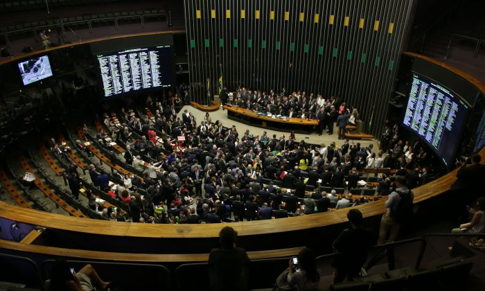 The Chamber of Deputies meets to vote on whether or not to impeachment Brazil's President Dilma Rousseff in Brasilia, Brazil, Sunday, April 17, 2016. The vote will determine whether the impeachment proceeds to the Senate. Rousseff is accused of violating Brazil's fiscal laws to shore up public support amid a flagging economy. (AP Photo/Eraldo Peres)
