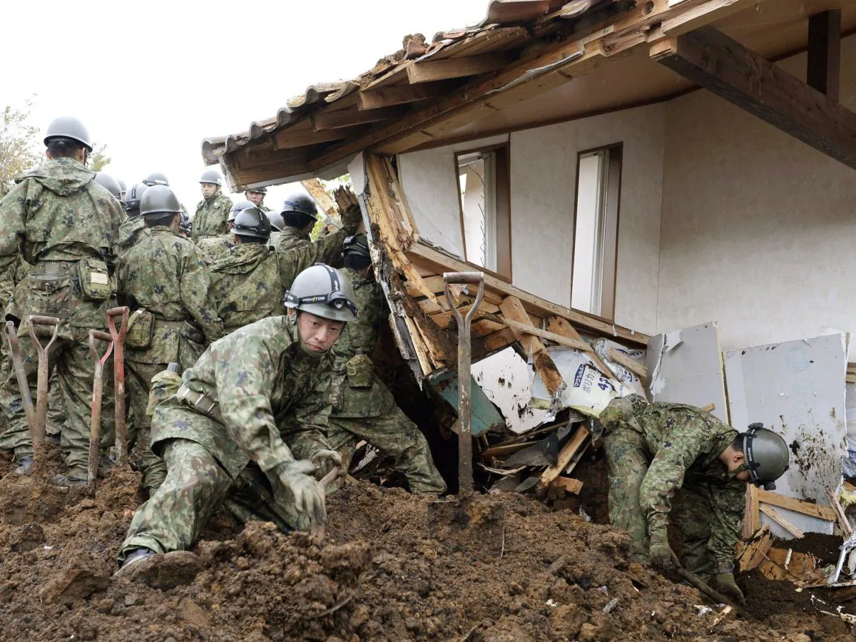 Members of Japan's Self-Defense Force search for missing persons at the site of a landslide in Minamiaso, Kumamoto prefecture, Japan Monday, April 18, 2016. About 10 people remained missing Sunday in southern Japan from two powerful earthquakes. Rescuers were redoubling search efforts on the southern island of Kyushu, where many areas were cut off by landslides and road and bridge damage. (Takuya Inaba/Kyodo News via AP) JAPAN OUT, MANDATORY CREDIT