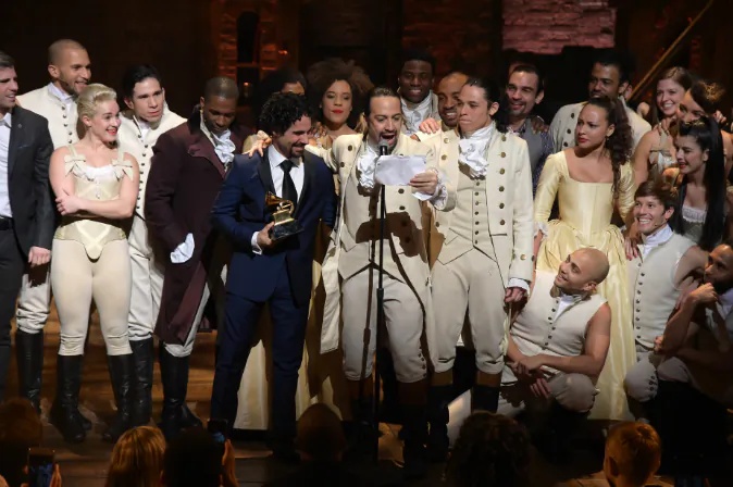 Music director Alex Lacamoire and Actor, composer Lin-Manuel Miranda celebrate on stage during 'Hamilton' GRAMMY performance for The 58th GRAMMY Awards at Richard Rodgers Theater on February 15, 2016 in New York City. (Photo by Theo Wargo/Getty Images)