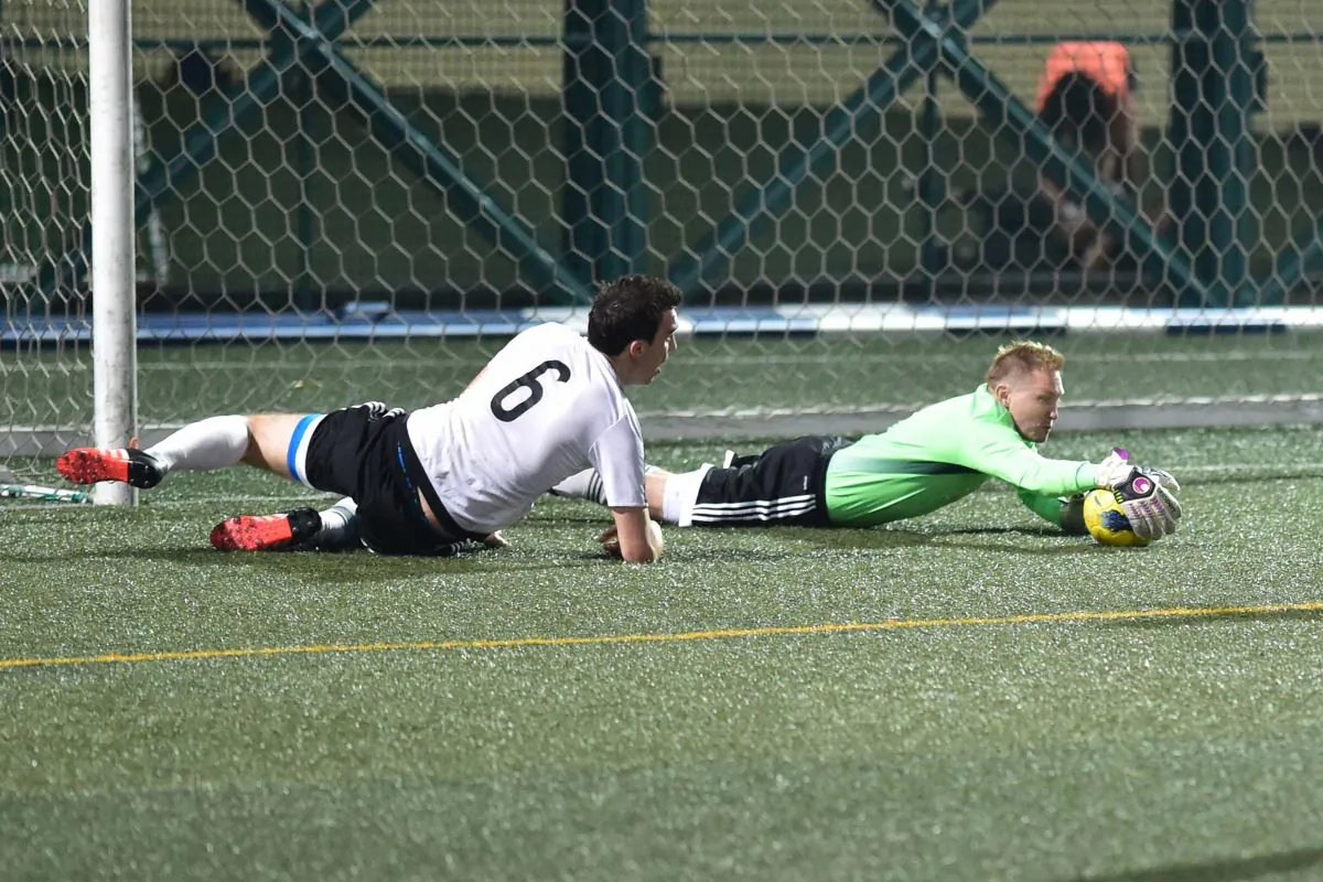 GAS Goalie, Adam Bilbey, makes one of his important interceptions of the season in the match against Club Colts on April 3 helping his team to another important win in their journey to the 2015-16 league title. (Bill Cox/Epoch Times)