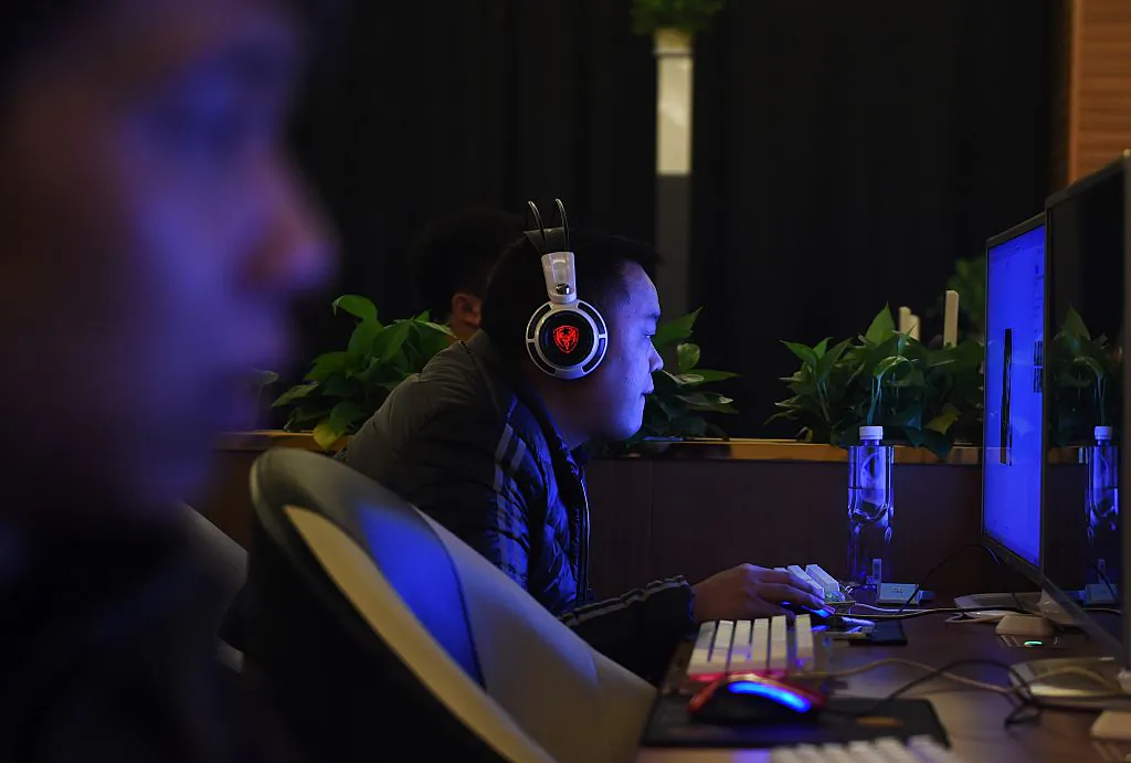 Men look at computers in an internet bar in Beijing on December 16, 2015. (Greg Baker/ AFP/Getty Images)