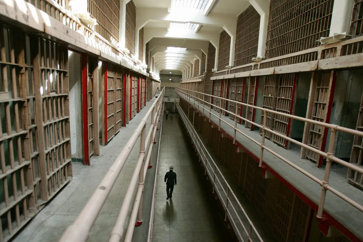 A National Park Service ranger walks down "Broadway" in the main cell block on Alcatraz Island in San Francisco Bay, Calif., on June 14, 2007. Sometimes referred to as "The Rock," Alcatraz Island served first as a military fortification, before it became a federal penitentiary in 1934. Now Alcatraz is national recreation area under the supervision of the Naitonal Park Service (NPS) with more than a million visitors a year taking the short ferry ride from San Francisco's Fisherman's Wharf to experience the infamous maximum-security prison for high-risk convicts. Famous island residents have included 'Machine Gun' Kelly, Al Capone, and Robert 'Birdman' Stroud. (Robyn Beck/AFP/Getty Images)