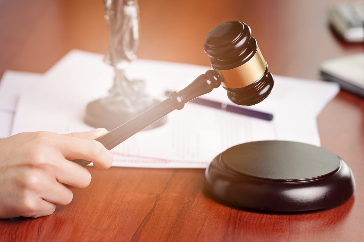 A judge holding a gavel. (iStock)