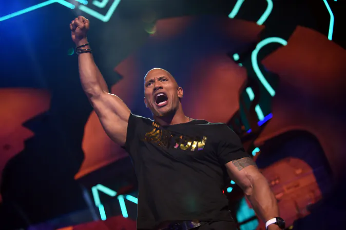 Host Dwayne Johnson speaks onstage during the 2016 MTV Movie Awards at Warner Bros. Studios on April 9, 2016 in Burbank, California. Photo by Emma McIntyre/Getty Images for MTV)
