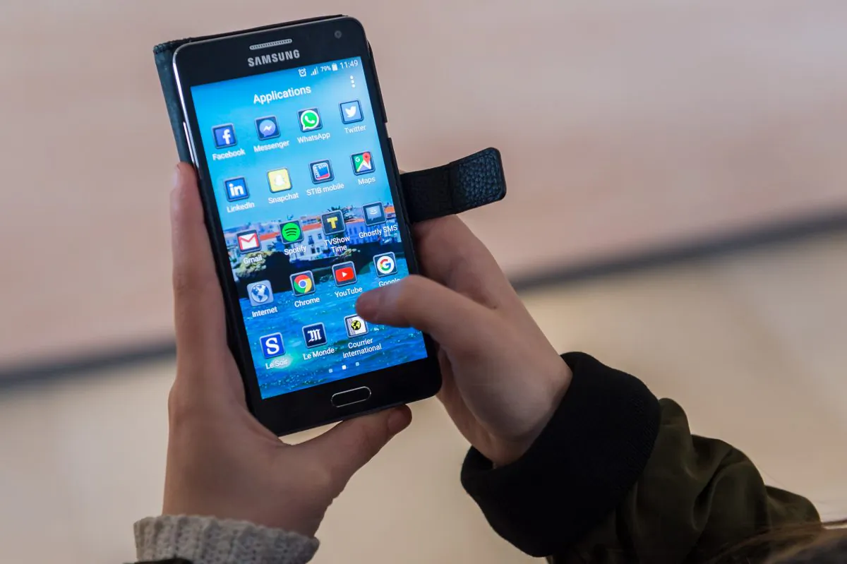 A woman uses an Android smartphone in Brussels, on April 20, 2016. (Geert Vanden Wijngaert/AP Photo)