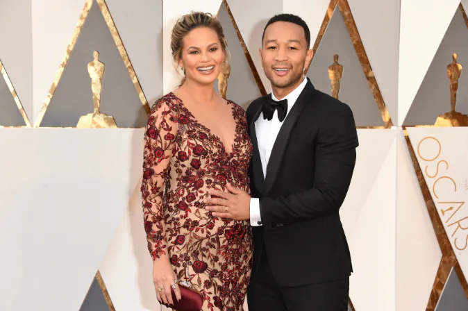 Model Chrissy Teigen (L) and recording artist John Legend attend the 88th Annual Academy Awards at Hollywood & Highland Center on February 28, 2016 in Hollywood, California. (Photo by Jason Merritt/Getty Images)