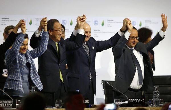 French President Francois Hollande (R), French Foreign Minister and president of the COP21 Laurent Fabius (2nd R), United Nations climate chief Christiana Figueres (L), and U.N. Secretary General Ban Ki-moon celebrate after the final conference at the COP2 in Le Bourget, Paris. (AP Photo/Francois Mori)