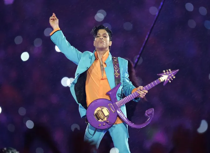 In this Feb. 4, 2007 file photo, Prince performs during the halftime show at the Super Bowl XLI football game at Dolphin Stadium in Miami. Prince, widely acclaimed as one of the most inventive and influential musicians of his era with hits including "Little Red Corvette," ''Let's Go Crazy" and "When Doves Cry," was found dead at his home on Thursday, April 21, 2016, in suburban Minneapolis, according to his publicist. He was 57. (AP Photo/Chris O'Meara)