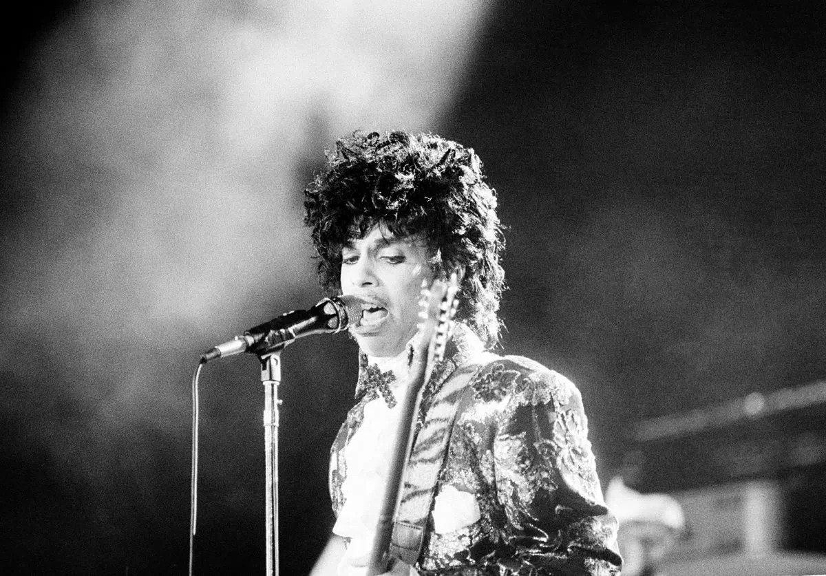 Rock singer Prince performs at the Orange Bowl during his Purple Rain tour in Miami, Fla., April 7, 1985. (AP Photo/Phil Sandlin)