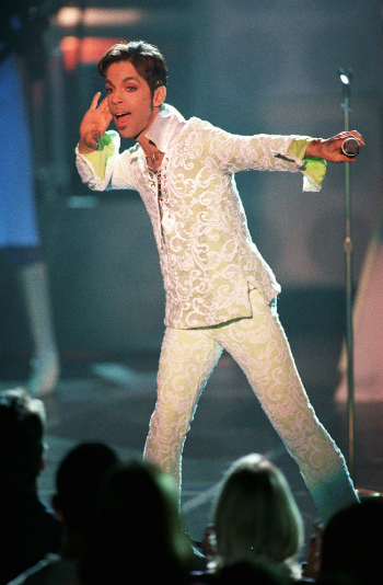 In this April 10, 1997 file photo, Prince performs a medley of "Take Me With U" and "Rasberry Beret" at the 4th annual VH1 Honors in Universal City, Calif.  (AP Photo/Mark J. Terrill, File)