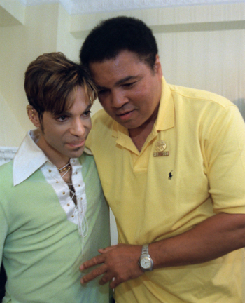 Boxing great Muhammad Ali, right, embraces the Artist Formerly Known as Prince, during a meeting in Washington Tuesday, June 24, 1997 prior to a news conference where they were to announce plans for a benefit concert in October. (AP Photo/Karin Cooper/Rogers & Cowan)