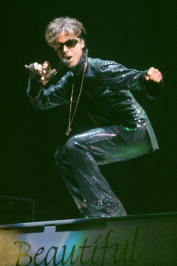 The Artist, formerly known as Prince, performs at the Festhalle in Frankfurt, Germany, Tuesday night, Dec. 22, 1998, during the first of three concerts in Germany as part of his "New Power Soul" tour. (AP Photo/Bernd Kammerer)